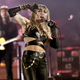 Illustration for article titled Miley Cyrus Joins Myspace in Spirit, Gets 'Rock n Roll' Heart Tattoo